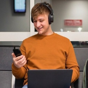 Man using phone at airport