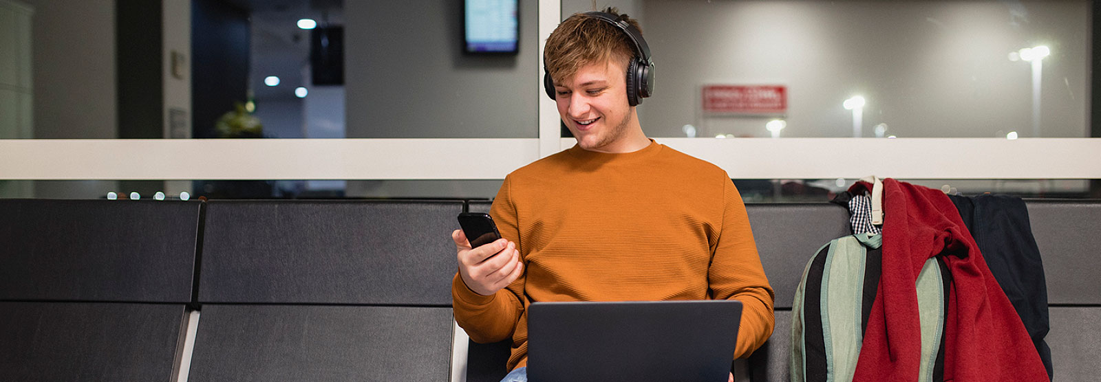 Man using phone at airport