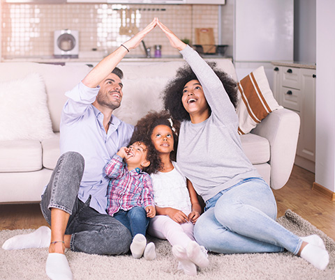 Family sitting in new house