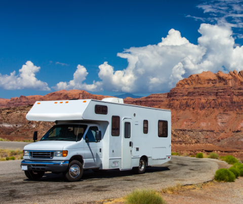 Image of RV camper in middle of canyon