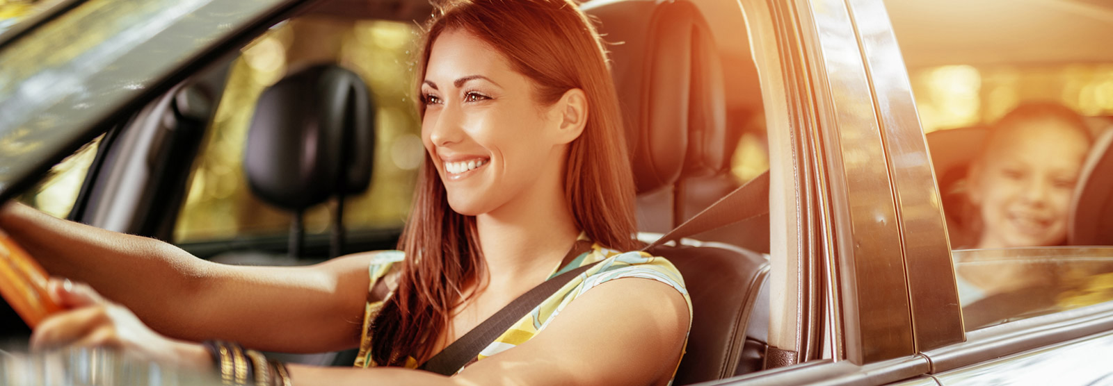 Mother and daughter riding in car