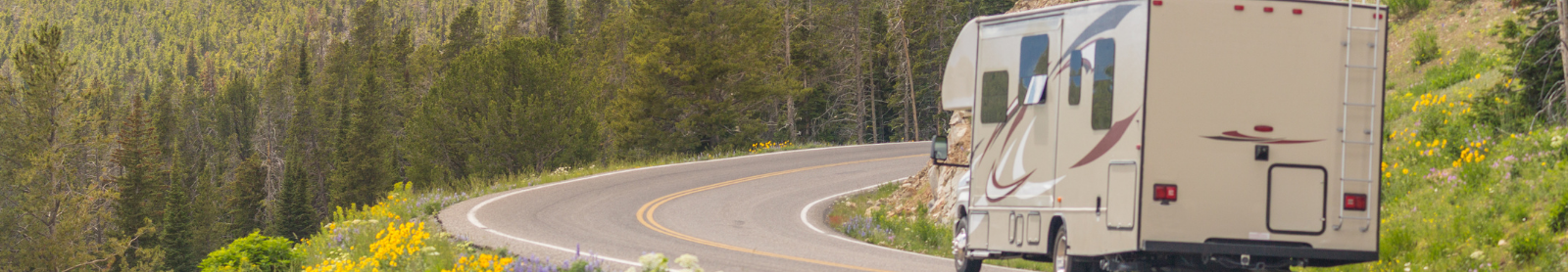 RV traveling down a mountain road